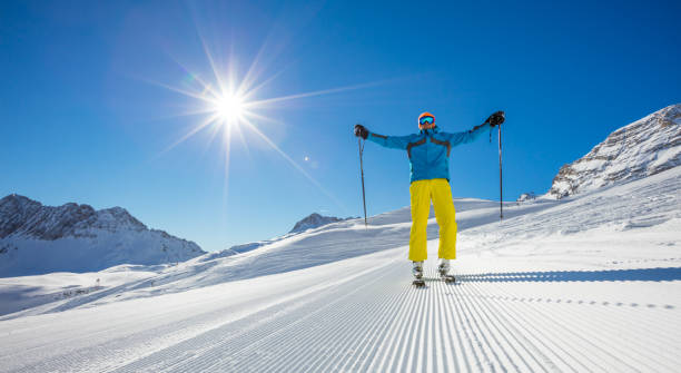 istock Skier on piste in sunny day. Skiing concept. 643021244