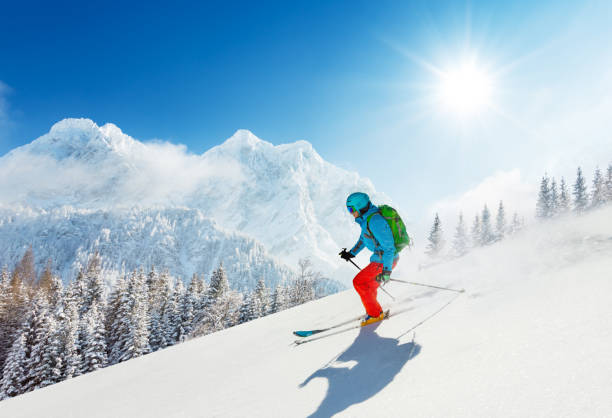 free-ride skier in fresh powder snow running downhill - skiing snow ski slope sunlight imagens e fotografias de stock