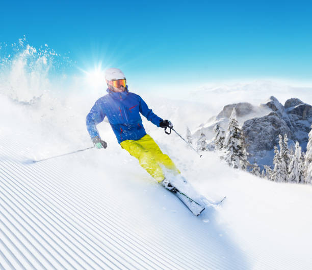 istock Skier on piste running downhill 643021776