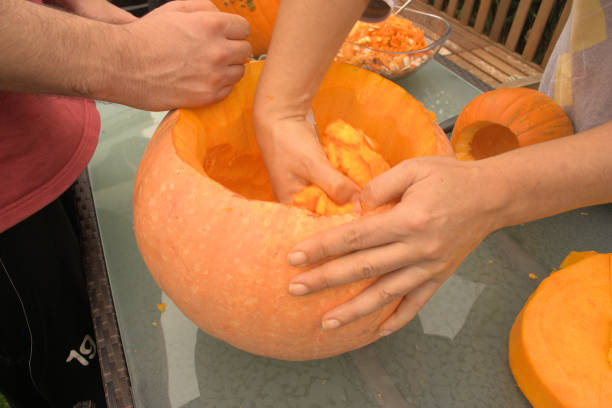 istock Pumpkin hollowing out for Halloween 643022008