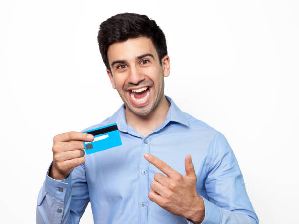 istock Excited man shouting and pointing at credit card 643024470