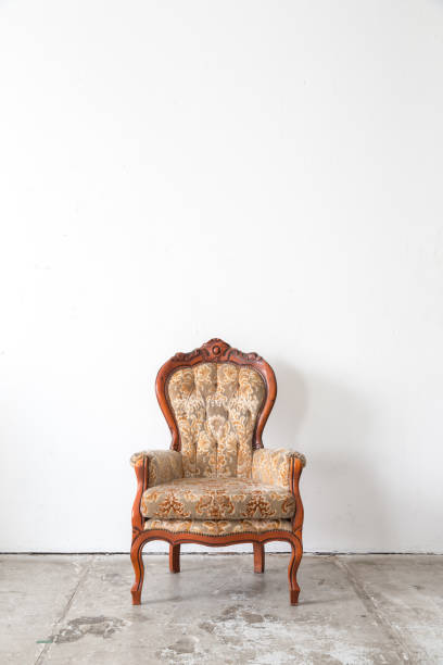 istock vintage armchair on white wall. 643025216
