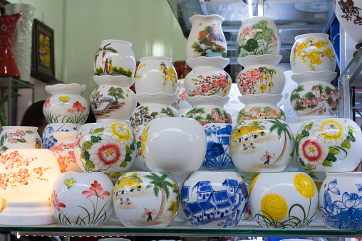 Hanoi, Vietnam - Jan 25, 2015: Pottery products on a shop in Bat Trang ancient ceramic village. Bat Trang village is the oldest and best known pottery village of Vietnam.