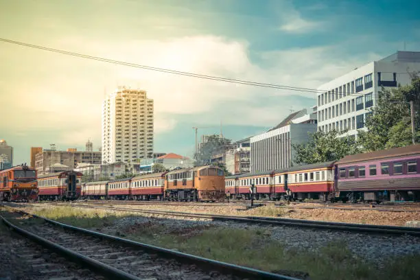 Photo of Railway train run on the railroad tracks. Many people in Thailand popular travel by train because it is cheaper. , process in vintage style