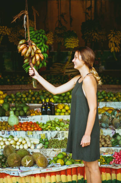 istock Woman in fruit store in Sri Lanka 643032188