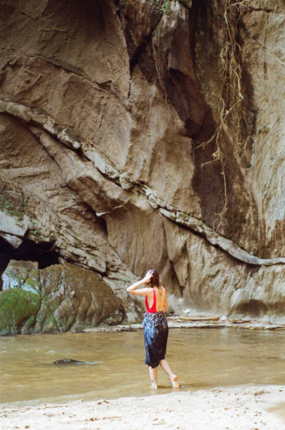 istock Woman near the waterfall 643032332