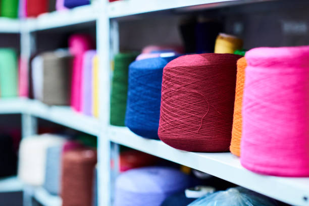 istock Multiple colorful yarn coils at market vendor, selective focus 643035366