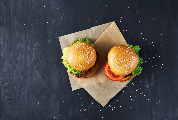 istock Craft beef burgers with vegetables. 643038836