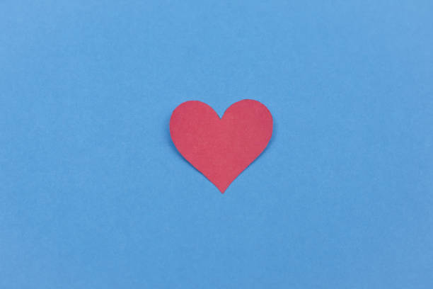istock Red paper heart on white background 643041894