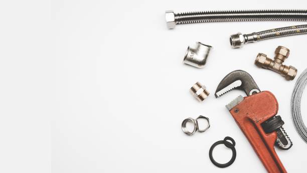 plumbing tools and equipment on white background with copy space