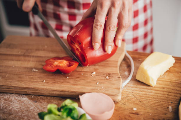 istock Woman slicing paprika 643046716