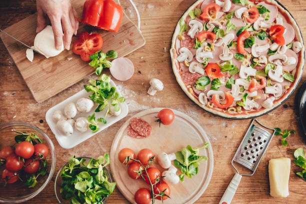 istock Woman slicing mozzarella cheese 643047232