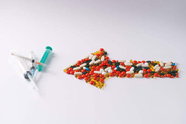 istock Syringes of different size and pills 643048060