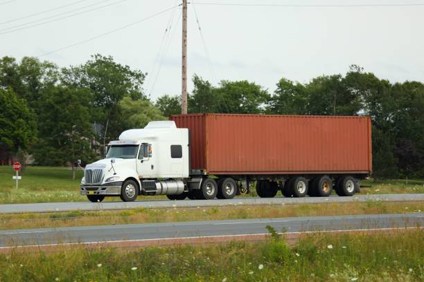 istock Semi Truck delivering its load on interstate highway 643050306