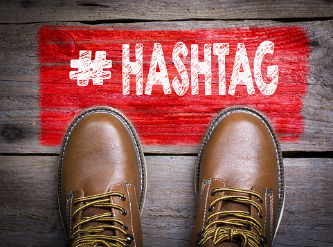 Hashtag. Top View of Boot on wooden background.