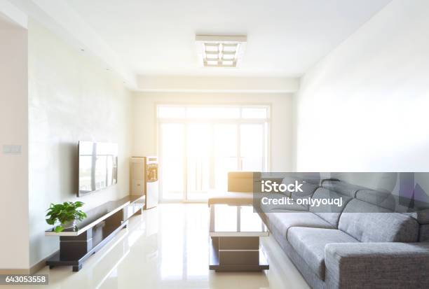 Modern And Clean Decoration Of An Apartment With A Sofa And A Lamp Stock Photo - Download Image Now