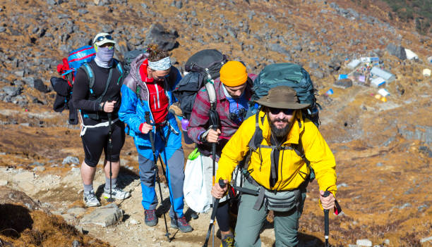 istock Group of Hikers walking up on Mountain Trail 643059888