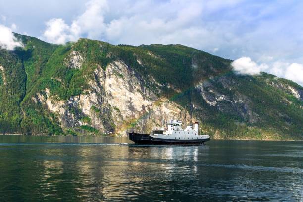 istock Ferry on the fjord with a rainbow, Norway 643063024