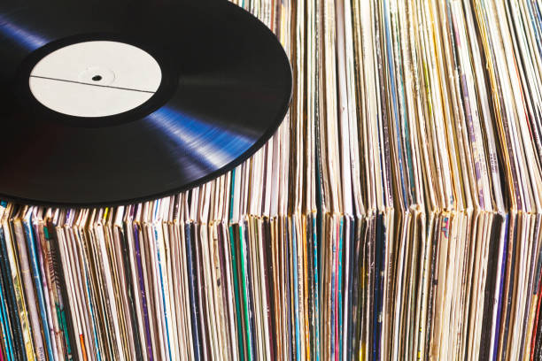 Vinyl record on a collection of albums stock photo