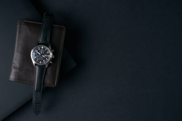 istock Watch and wallet on dark background 643071400