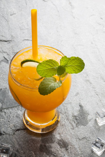 istock oranges and juice on stone table top view copy space 643074020