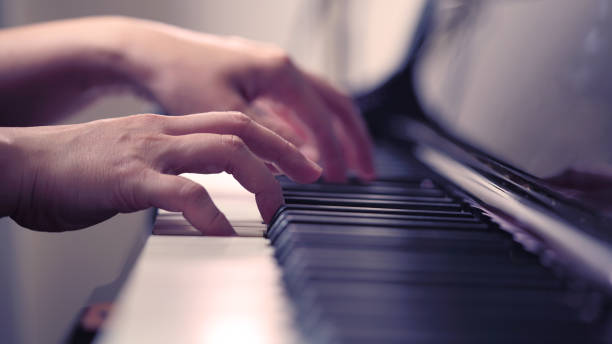 istock Scene of pianist hands from beside angle playing piano 643076748