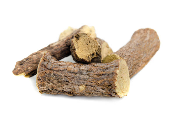 istock Licorice or liquorice root sticks isolated on white background 643077172