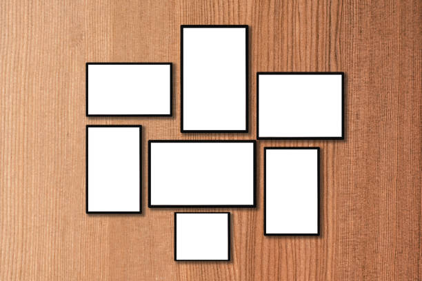 istock blank black frames on old wooden wall vintage style 643078128