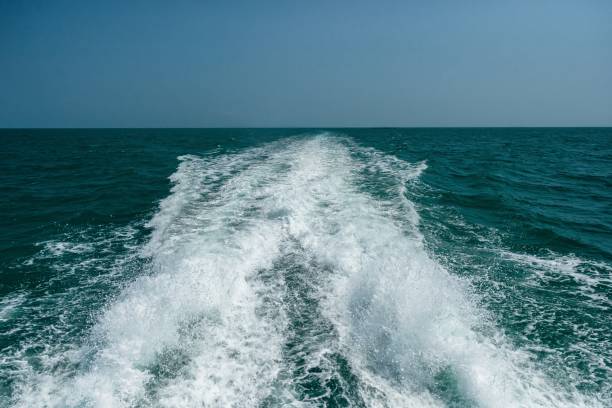 istock Acting wave behind motor boat at the vast ocean 643080216