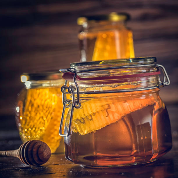 istock Honey in Jar with Honeycomb 643089902