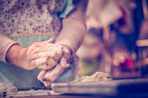 Preparing fresh homemade gnocchi pasta with potato dough.