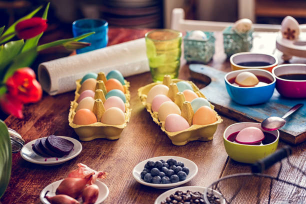 Naturally Dyed Easter Eggs Naturally dyed Easter eggs with saffron, parsley, red cabbage, onion, red wine, blueberry, coffee, beet, carrot tumeric and spinach easter egg coloring stock pictures, royalty-free photos & images