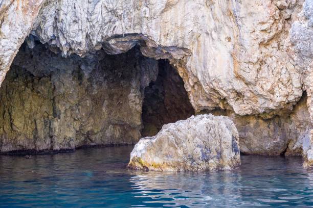 istock cave and grotto in stone mountain or rock at sea 643103914