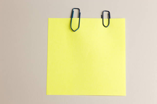 istock Paper clip and yellow note paper 643106502