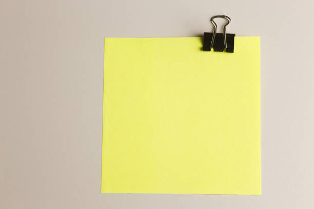 istock Paper clip and yellow note paper 643106812