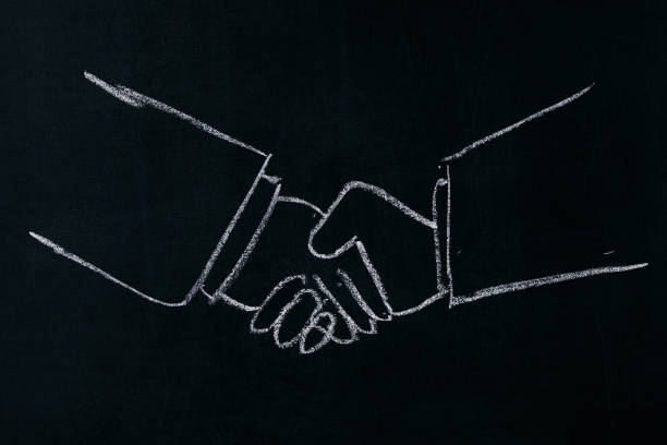 istock businessman shaking hands each other. 643109920