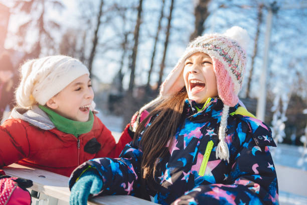 istock Girls having fun in winter 643112532