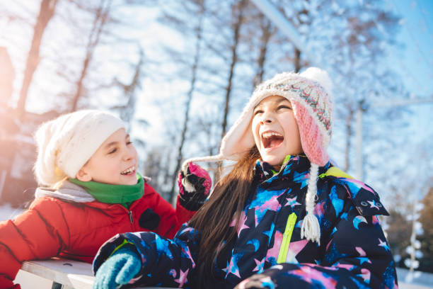 istock Girls having fun in winter 643112540