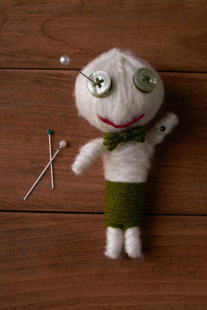 istock Cute Little Voodoo Doll with pins 643113414