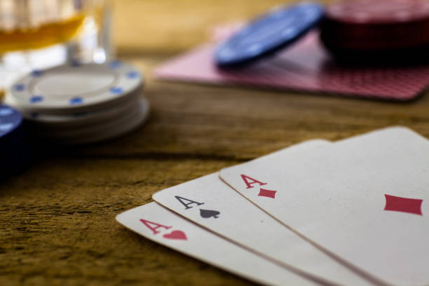 istock Playing Cards on wooden table 643113542