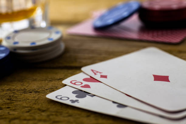 istock Playing Cards on wooden table 643113558