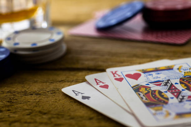 istock Playing Cards on wooden table 643113582