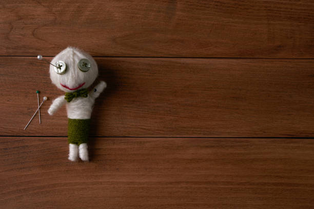 istock Cute Little Voodoo Doll with pins 643113648