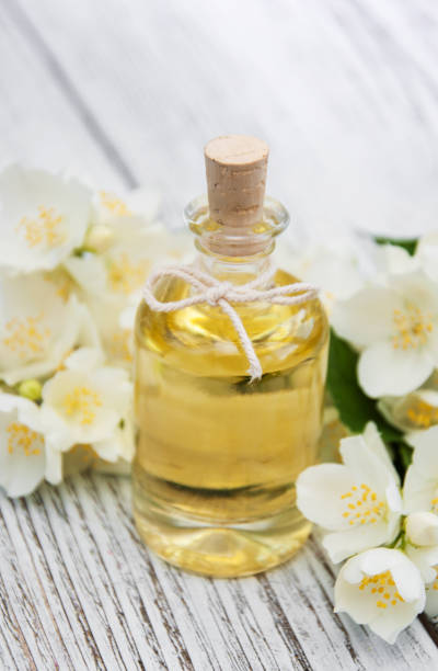 istock Massage oil with jasmine flowers 643116454