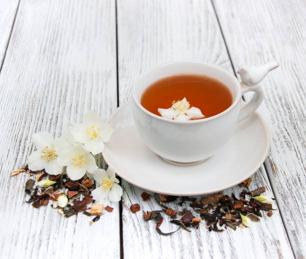 istock Cup of tea with jasmine flowers 643116470