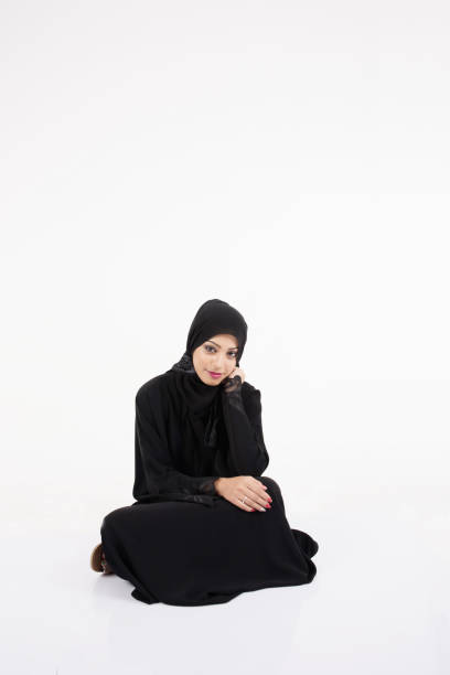 istock Arab woman Sitting on the floor 643119598
