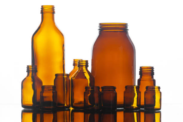 istock Many medicine glass bottles on the white background 643130356