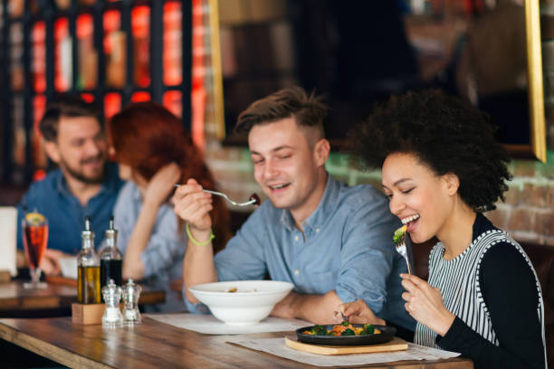 istock Friends talking and having fun at dinner party. 643136874