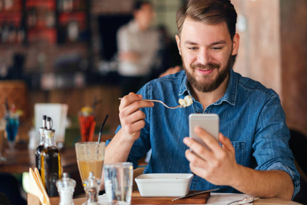 istock Young  man eating vegetarian salad 643136964