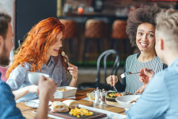 istock Friends talking and having fun at dinner party. 643137276